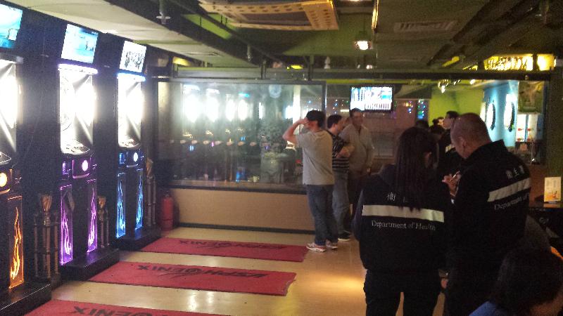 Tobacco Control Inspectors conduct an inspection at a bar.