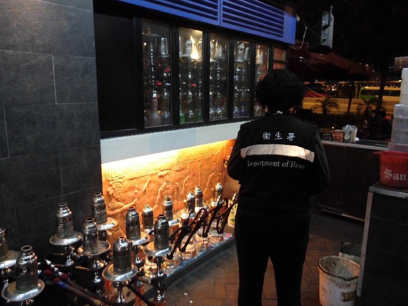 Tobacco Control Inspectors conduct an inspection at a bar which provides waterpipes for smoking.